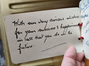 Handwritten note reading "With  our very sincere wishes for your success and happiness in all that you do in the future."